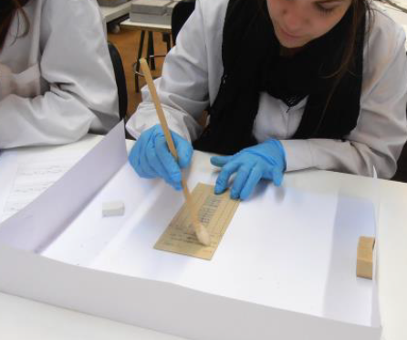 Conservation of the timecards: a) dry cleaning using a brush; b) execution of the encapsulation bags