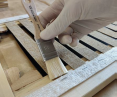 The mock-ups: a) applied on wooden stretchers prior to the application of the consolidants, in order to avoid deformations induced by the use of waterbased materials; b) application of CNC